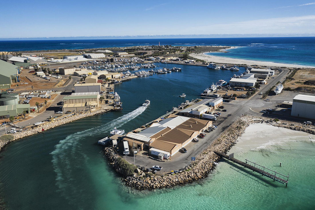 Boat entering channel to Fishing Boat Harbour.