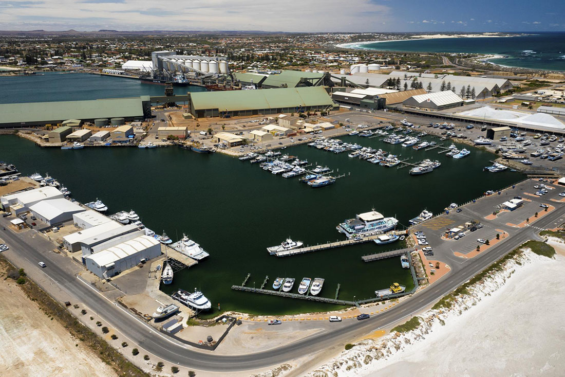 View of Fishing Boat Harbour from the south. Many small and large boats are in their pens.