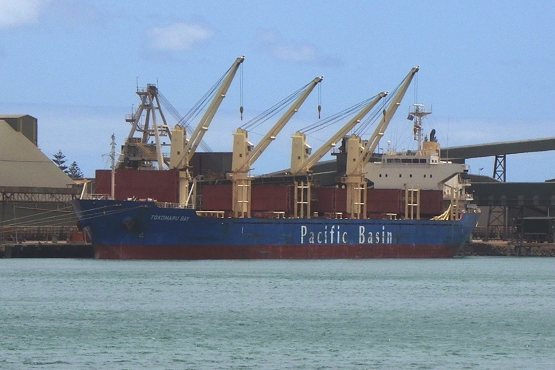 Blue box fuel bowser with yellow posts around it at Fishing Boat Harbour